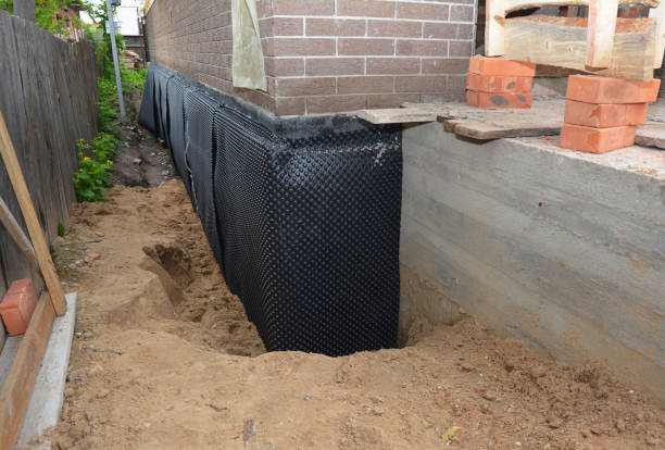 Happy homeowners after waterproofing job in Cochranville